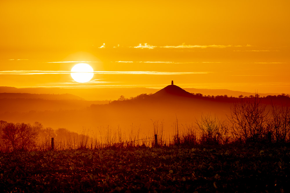 Sunset over Glastonbury Tor - From above West Compton, Nr Shepton Mallet, Somerset, UK. ID JB_7704H